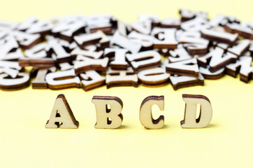 Wooden letters of the English alphabet close-up, background, education concept