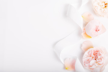 Festive flower composition on the white wooden background. Overhead view