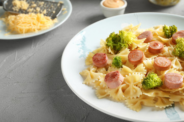 Delicious pasta with sausage on plate
