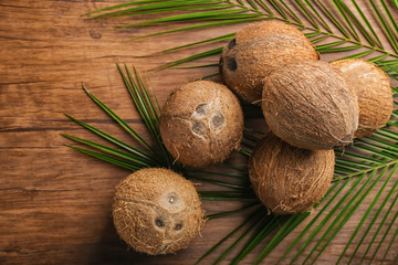 Ripe coconuts on wooden background