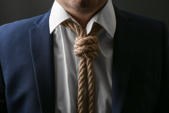 Man with noose around neck, closeup. Suicide awareness concept