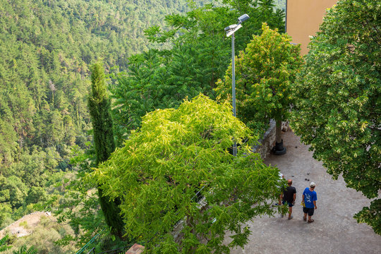 Unidentifiable locals playing petanque in Peille, a hilltop village in southeastern France