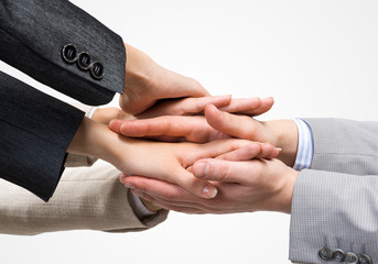 Obraz premium Concept of teamwork and unity with palms one on one in pile