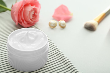 Jar of cream on light background
