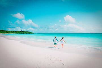 Fototapeta na wymiar happy loving couple enjoy tropical beach vacation