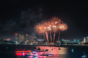 Fireworks international colorful Pattaya beach cityscape at night scene for advertise traveling event holiday., Pattaya city