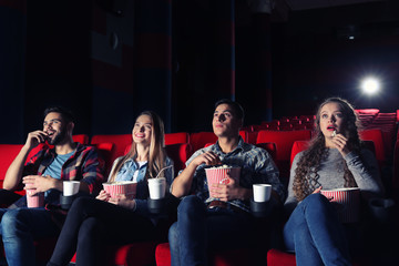 Friends watching movie in cinema
