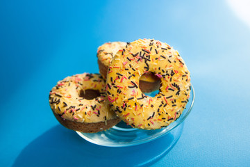 Yellow dessert on blue background with sunshine, sweet food