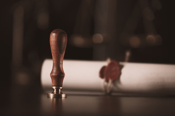 Notary's public pen and stamp on testament and last will. Notary public tools.Closeup of an ancient...