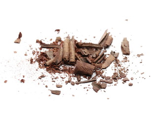 Cinnamon sticks with powder and shavings, macro isolated on white background