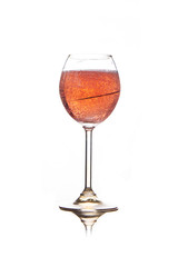 Rose pink champagne glass with bubbles isolated on white background