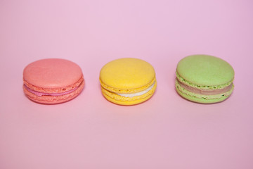 Macaroon dessert on pink background, pastel colors sweet food