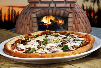 Baked pizza in the wood oven