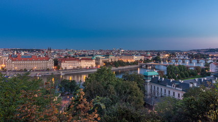 Evening Panorama of Prague with Vltava river and Prague Bridges day to night timelapse.
