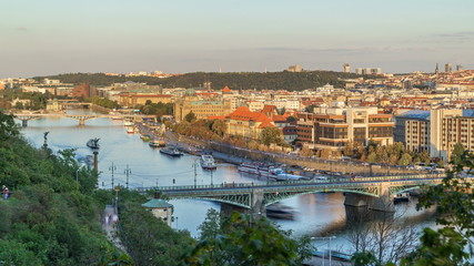 Fototapeta premium Aerial sunset view of the Vltava River and bridges evening timelapse, Prague