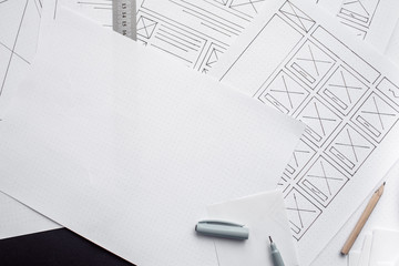 UX website designer drawing wireframe sketch of prototype, framework, layout future project....