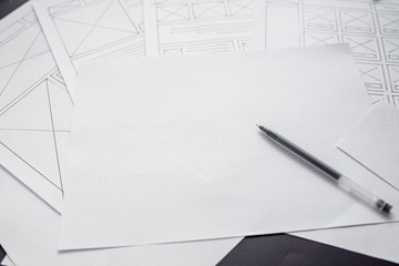 UX website designer drawing wireframe sketch of prototype, framework, layout future project....