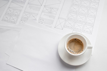 UX website designer drawing wireframe sketch of prototype, framework, layout future project....