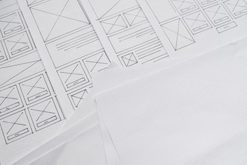 UX website designer drawing wireframe sketch of prototype, framework, layout future project....