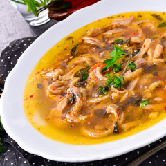 Traditional tripe soup in polish style with beef and vegetables