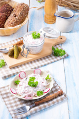 delicious homemade meat salad with mayonnaise and cucumber
