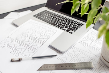 UX website designer drawing wireframe sketch of prototype, framework, layout future project....