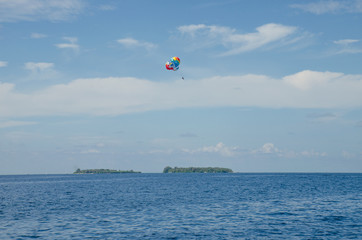 Parachute in the sky over Indian oceans the island of Maldives