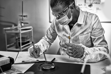 Forensic Science Technician Analyzing Evidence in Laboratory