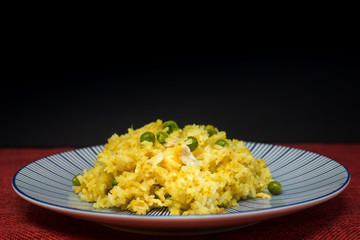 Homemade Chinese fried rice with vegetables and fried eggs