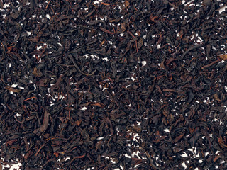 background of black tea leaves. precious ring. decorations.