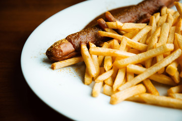 Grilled sausage served with french fries