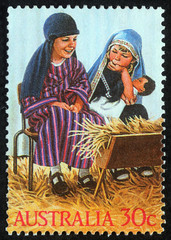 Christmas stamp printed in Australia shows children play to the Holy Family, circa 2004