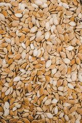 Raw pumpkin seeds background for design
