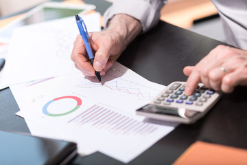 Businessman analyzing graphics