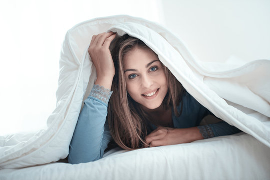 Woman Hiding Under Covers