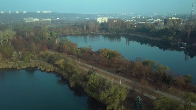 Aerial footage over Echo Park Lake, Kishinev, Moldova republic of. View of lake and smille bridge.