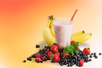 Healthy Fruit Smoothie in glass on wooden table Background