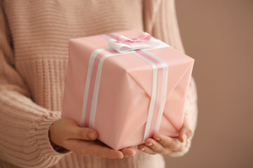 Young woman with gift box, closeup