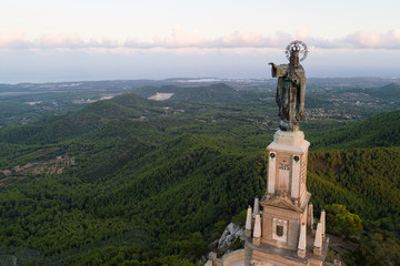 Aerial view of Jesus Christ statue at Sant Salvador Sanctuary, Mallorca island, Spain