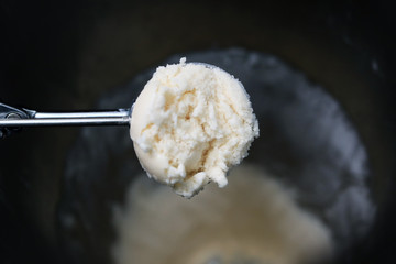 Coconut milk ice-cream in scoop.