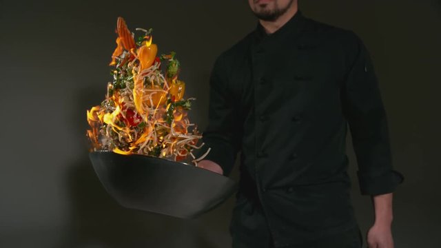 Chef with flaming stir fry in super slow motion, shot with Phantom Flex 4K