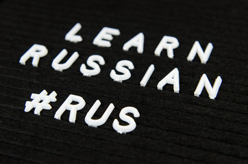 Fototapeta premium Learn Russian, RUS abbreviation, simple sign on black background, great for teachers, schools, students