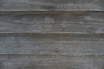 Weathered wooden boards on the side of a house