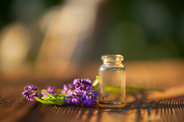 lavender essential oil in  beautiful bottle on table