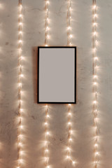 empty frame on the wall with lights