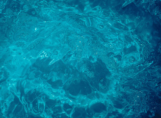 Fototapeta na wymiar background image of water, blue water, bubbles, waves, stains 