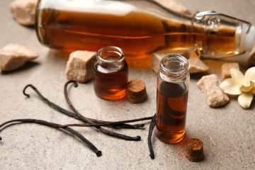 Composition with vanilla extract on grey background