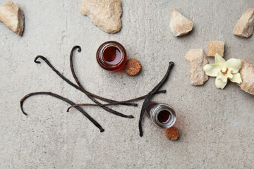 Composition with vanilla extract on grey background