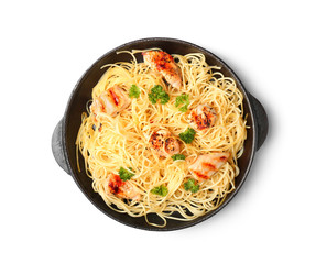 Pan with tasty pasta and chicken on white background