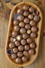 Macadamia nuts in a wooden bowl